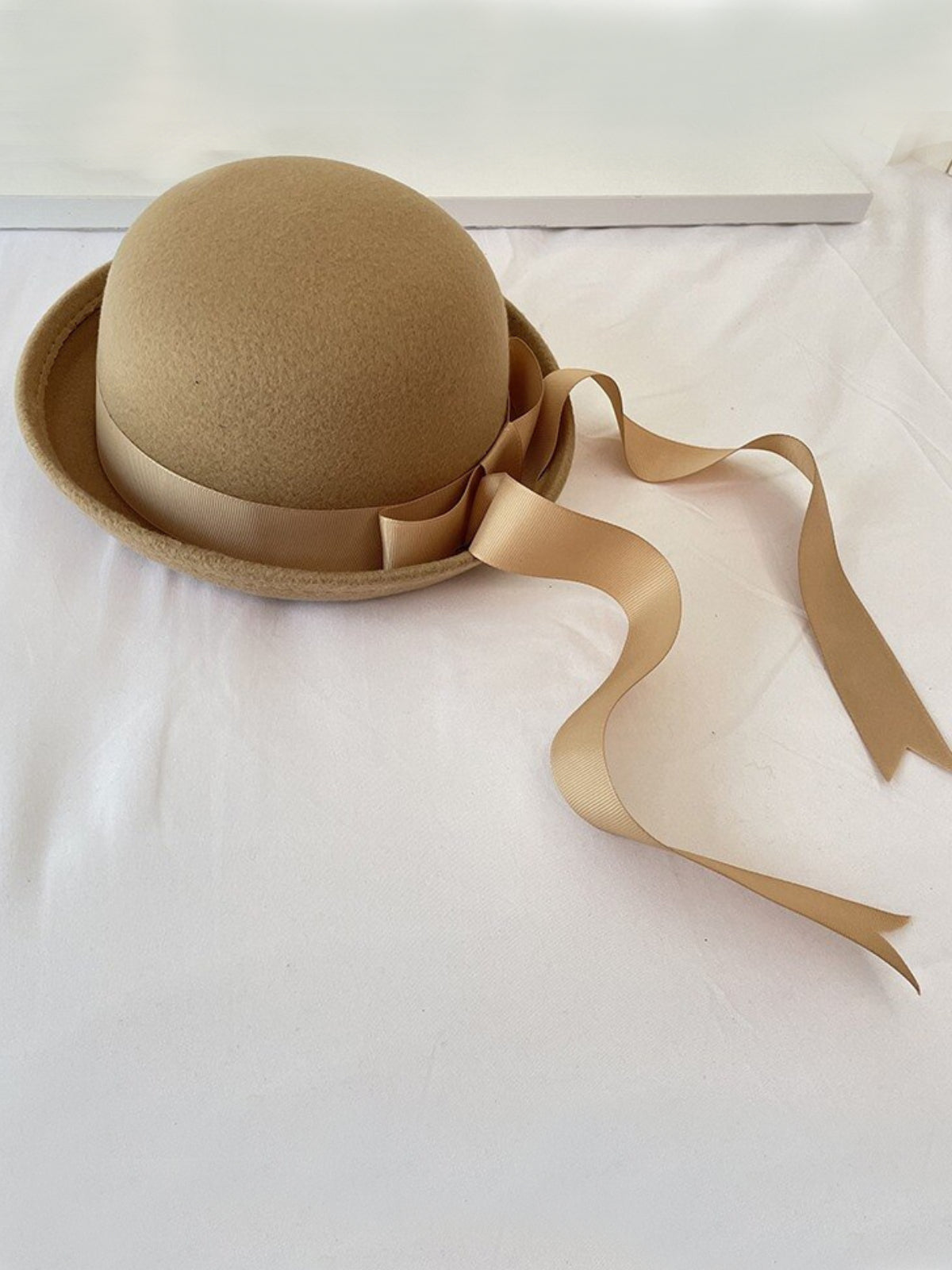 Beige bowler hat hotsell