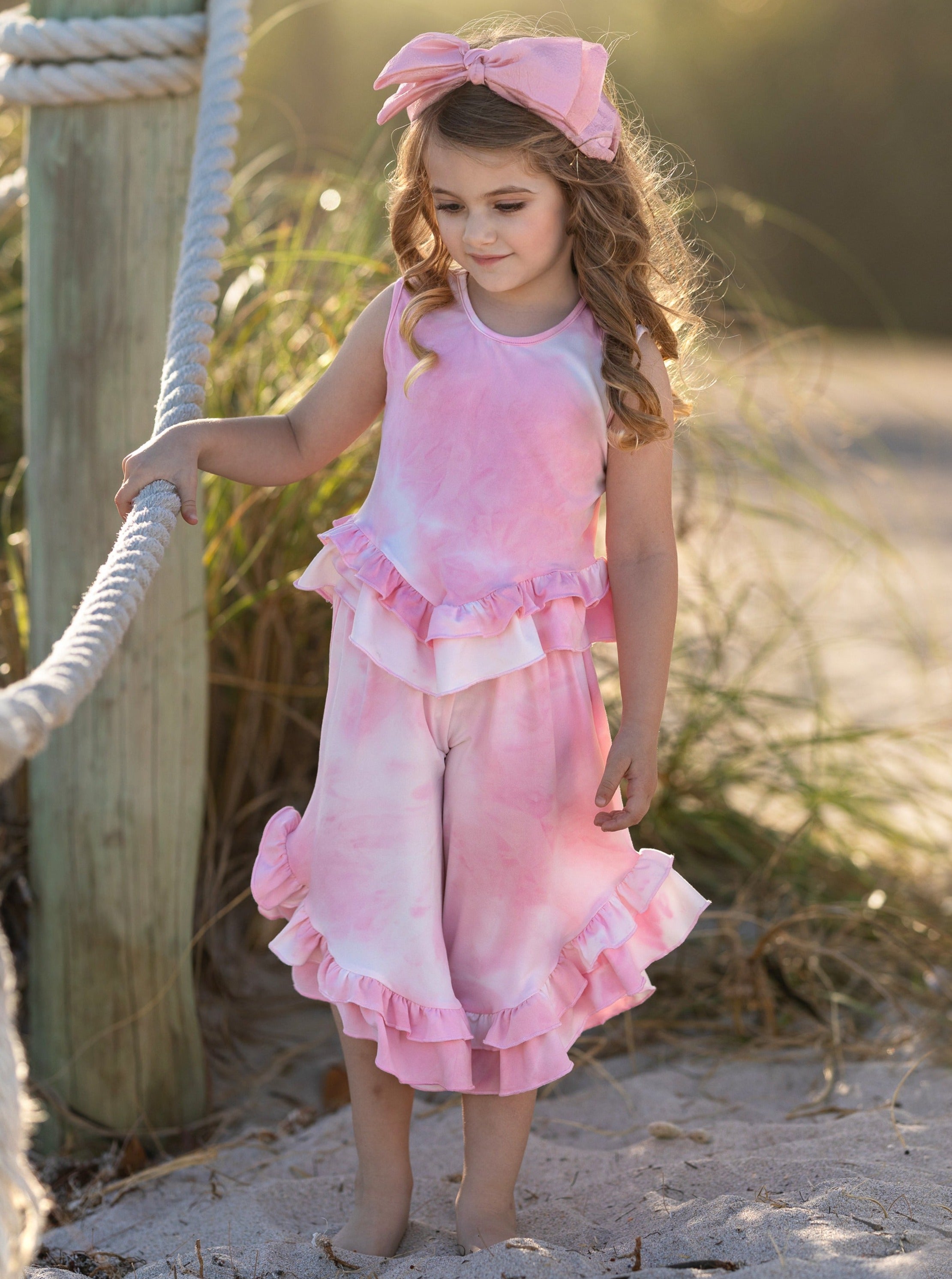 Little girl shops ruffle outfits