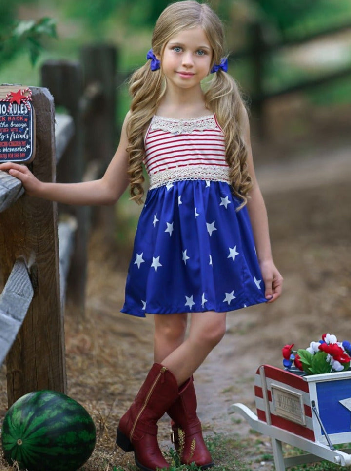 Girls 4th of July dress features a sleeveless red/white striped bodice with crochet details and blue/white star print skirt 2T-10Y for toddlers and girls