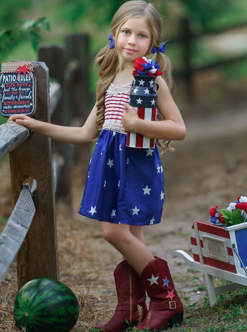 Girls 4th of July dress features a sleeveless red/white striped bodice with crochet details and blue/white star print skirt 2T-10Y for toddlers and girls