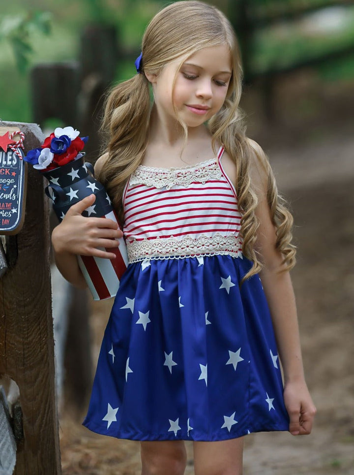 Girls 4th of July dress features a sleeveless red/white striped bodice with crochet details and blue/white star print skirt 2T-10Y for toddlers and girls