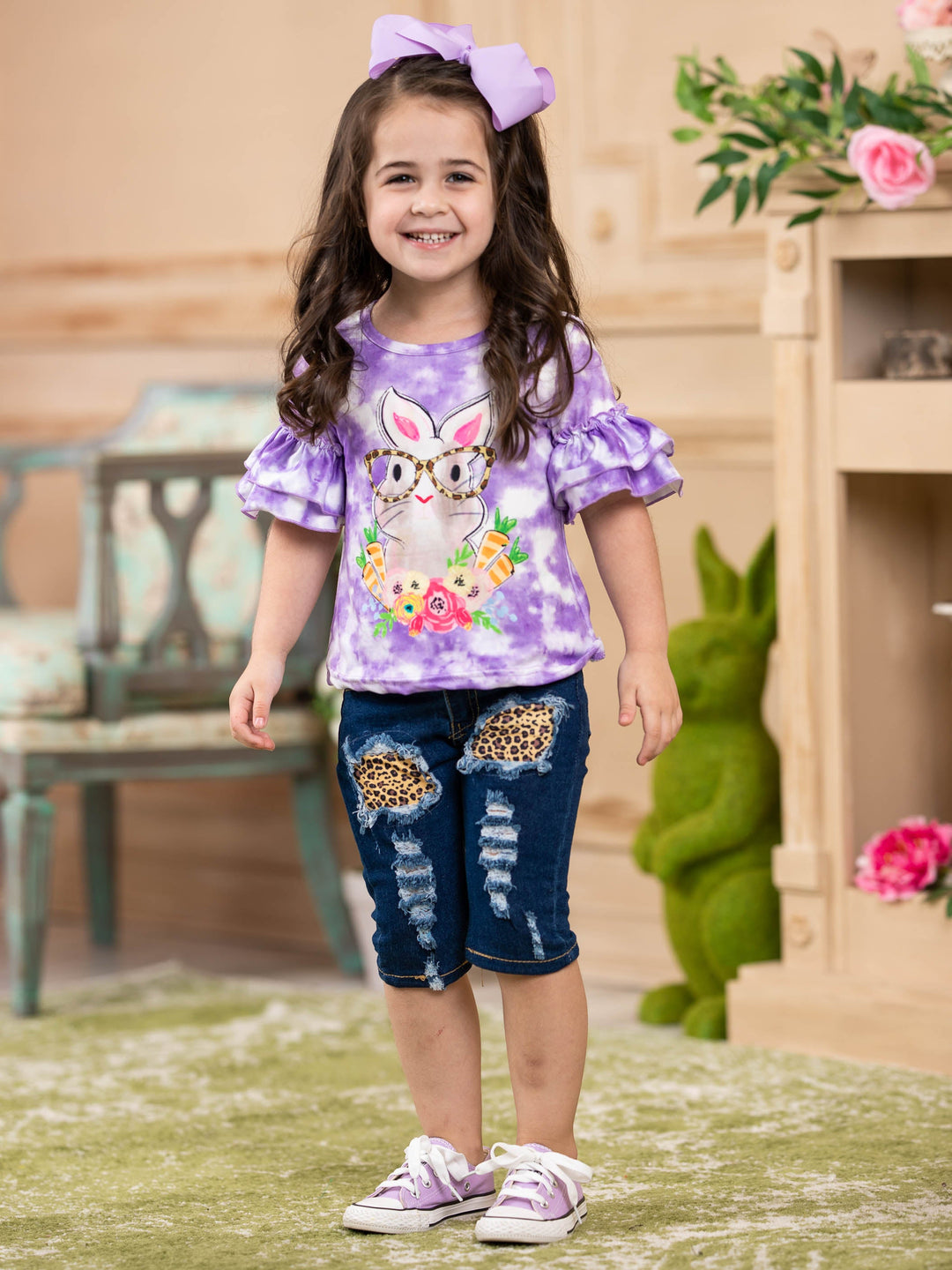 Girls Easter-themed set features a purple tie-dye top with bunny graphic and leopard print patched jeans with sash for 2T to 10Y toddlers and girls