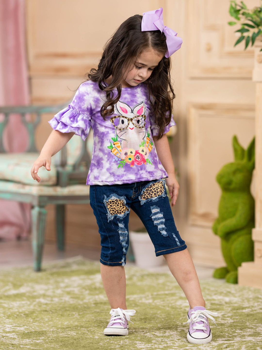 Girls Easter-themed set features a purple tie-dye top with bunny graphic and leopard print patched jeans with sash for 2T to 10Y toddlers and girls