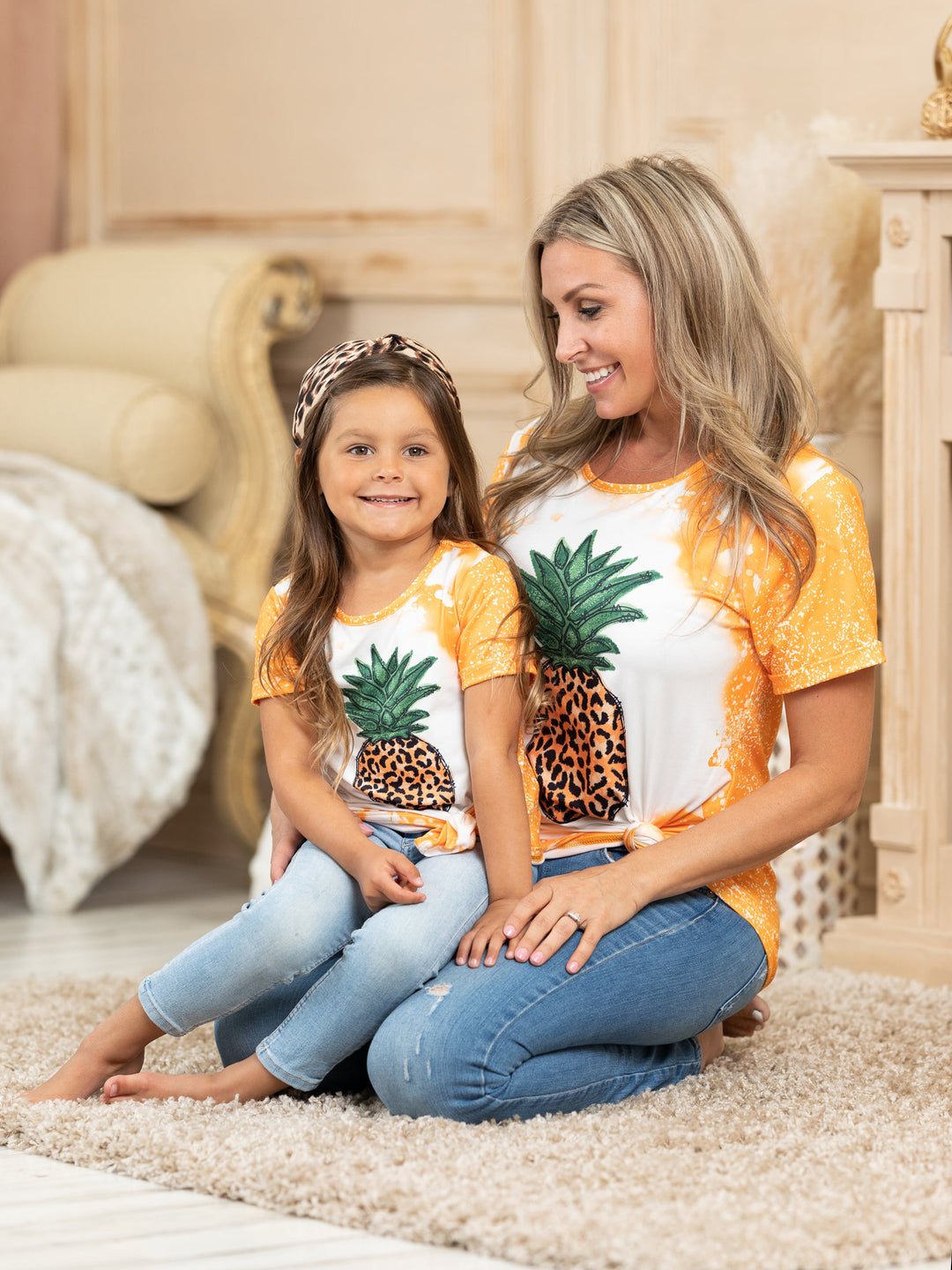 Mother-daughter top features tie-dye sleeves, back, and hem with a leopard print pineapple graphic design - 12MON-8Y for toddlers and girls and S to XL for Moms