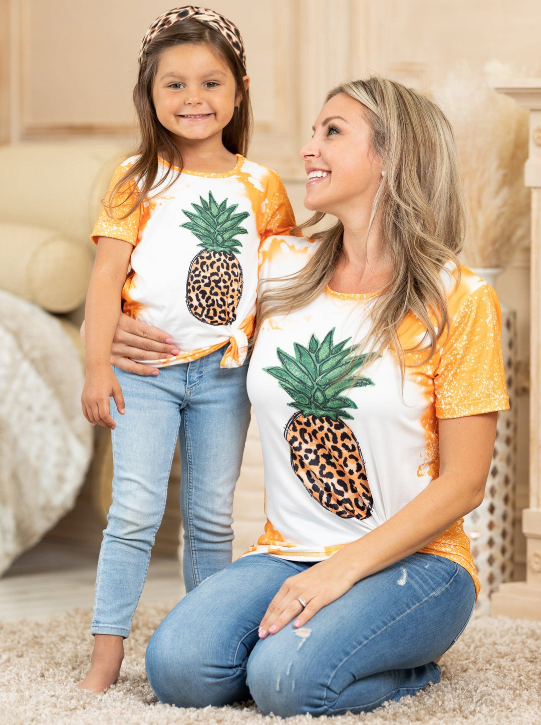 Mother-daughter top features tie-dye sleeves, back, and hem with a leopard print pineapple graphic design - 12MON-8Y for toddlers and girls and S to XL for Moms