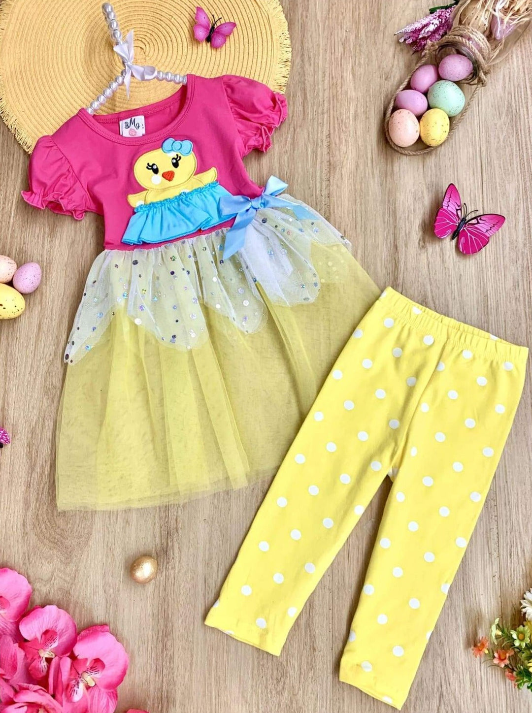 Girls Spring Easter-themed set features ruffle sleeves, chick applique, and two-tier sequin tulle hem with stretchy polka dot capris-length leggings for 2T to 10Y toddlers and girls