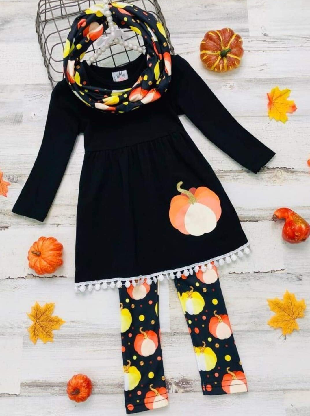 Little girls long-sleeve tunic with pom-pom hem, pumpkin print graphic, and matching leggings and infinity wrap scarf - Mia Belle Girls