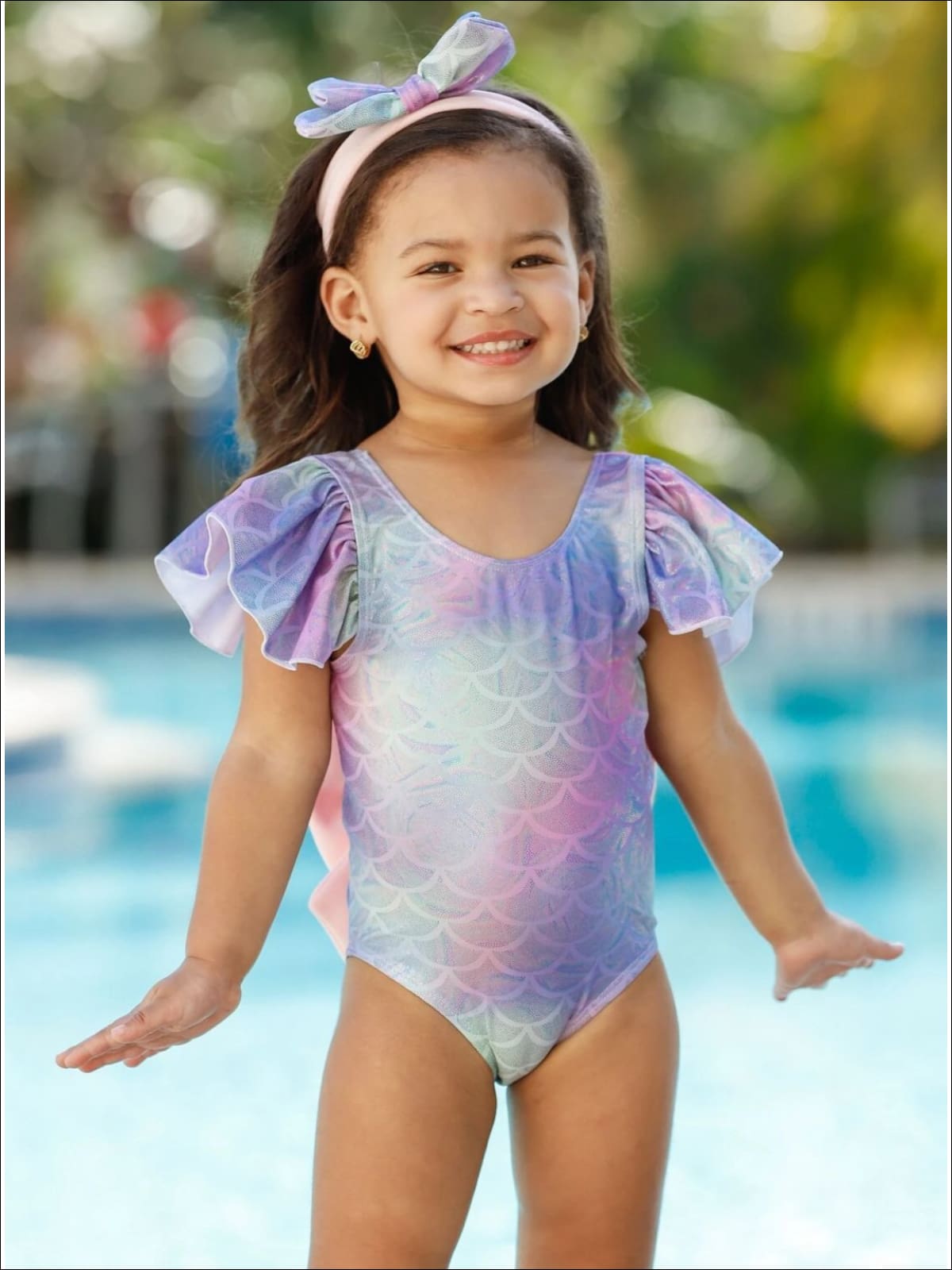 https://www.miabellebaby.com/cdn/shop/products/girls-mermaid-scales-ruffled-sleeve-one-piece-swimsuit-20-39-99-40-59-2t3t-4t5y-6y6x-mia-belle-baby_826_1400x.jpg?v=1639684430